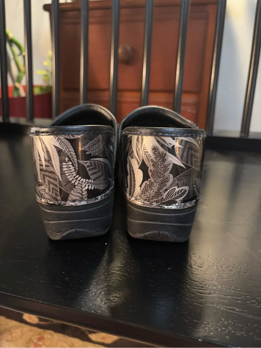 Dansko Black Clogs with Silver Floral Print